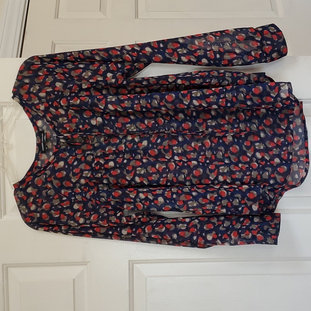 Tie neck semi sheer blouse.